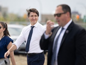 In this May 24, 2022 file photo, Prime Minister Justin Trudeau visits the crop development research plots at the University of Saskatchewan in Saskatoon.