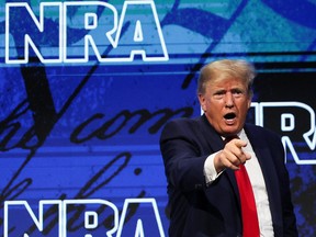 Former U.S. President Donald Trump gestures during the National Rifle Association (NRA) annual convention in Houston, Texas, May 27, 2022.