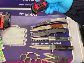 Some of the 23 weapons seized by security officials at Reagan National Airport on May 4, 2022.