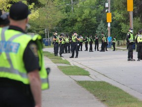 London police officers will be outfitted with new high-visiblity vests with name tags attached in response to a complaint that the current vests worn by officers, shown here in this file photo, block the officers' name tags. (File photo)