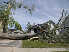 Residents in Uxbridge clean up on Monday, May 23, 2022 after a weekend storm destroyed residential and commercial properties.