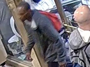 Investigators need help identifying a man who is suspected of punching a person in a wheelchair in the area of Yonge and College Sts. on April 25, 2022.