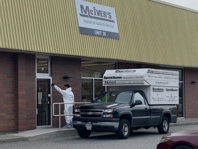 June 27, 2019 - Vancouver Police investigate the suspicious death of John McIver at his appliance store in East Vancouver. McIver was found dead in the shop this morning. Harrison Mooney photo. [PNG Merlin Archive]