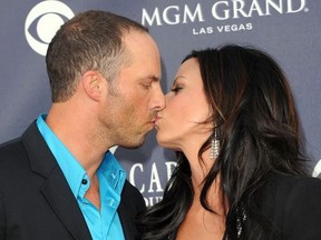 Radio personality Jay Barker (L) and singer Sara Evans arrive at the 46th Annual Academy Of Country Music Awards RAM Red Carpet held at the MGM Grand Garden Arena on April 3, 2011 in Las Vegas, Nevada.