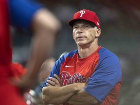 Joe Girardi of the Philadelphia Phillies in the dugout during the fourth inning against the Atlanta Braves at Truist Park on May 24, 2022 in Atlanta, Georgia.