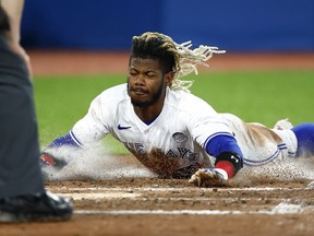 Raimel Tapia of the Toronto Blue Jays scores his second run of the game on a triple by Santiago Espinal #5 in the fifth inning during a MLB game against the Chicago White Sox at Rogers Centre on June 02, 2022 in Toronto, Ontario, Canada.
