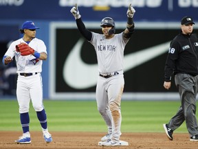 Gleyber Torres of the New York Yankees takes second base as he hits home DJ LeMahieu with an RBI double in the fourth inning of their MLB game against the Toronto Blue Jays at Rogers Centre on June 17, 2022 in Toronto.