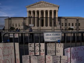 Signs left by abortion-rights supporters line the security fence surrounding The Supreme Court on June 28, 2022 in Washington, DC