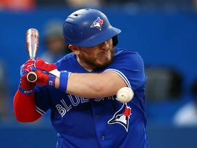 Alejandro Kirk #30 of the Toronto Blue Jays is hit by a pitch in the third inning against the Boston Red Sox at Rogers Centre on Wednesday.