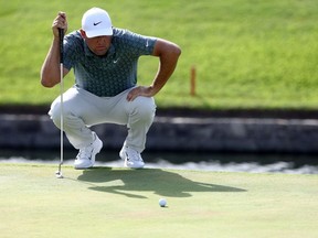 Scottie Scheffler of the United States lines up a putt on the 18th hole during the final round of the Charles Schwab Challenge at Colonial Country Club on May 29, 2022 in Fort Worth, Texas.