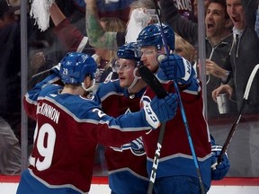 Cale Makar #8 of the Colorado Avalanche celebrates with Valeri Nichushkin #13 and Nathan MacKinnon #29 after scoring a goal against the Edmonton Oilers during the first period in Game One of the Western Conference Final of the 2022 Stanley Cup Playoffs at Ball Arena on May 31, 2022 in Denver, Colorado.