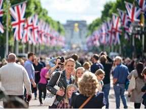Members of the public walk along the Mall ahead of the upcoming Jubilee events on May 22, 2022 in London, England.
