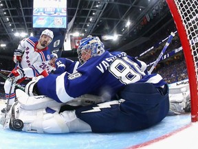 Chris Kreider of the New York Rangers scores a power play goal past Andrei Vasilevskiy #88 of the Tampa Bay Lightning assisted by Artemi Panarin and Mika Zibanejad in Game Three of the Eastern Conference Final of the 2022 Stanley Cup Playoffs against the Tampa Bay Lightning at Amalie Arena on June 05, 2022 in Tampa, Florida.