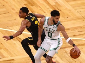 Jayson Tatum #0 of the Boston Celtics dribbles against Jordan Poole #3 of the Golden State Warriors in the second quarter during Game Three of the 2022 NBA Finals at TD Garden on June 08, 2022 in Boston, Massachusetts.
