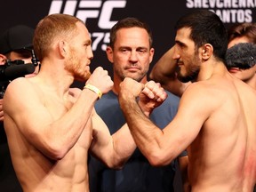 Jack Della Maddalena (L) of Australia and Ramazan Emeev of Russia face off ahead of their welterweight bout during the UFC 275 Weigh-in at Singapore Indoor Stadium on June 10, 2022 in Singapore.