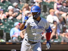 Teoscar Hernandez gestures to the Blue Jays dugout after his two-run home run in the seventh inning against the Chicago White Sox at Guaranteed Rate Field on June 22, 2022 in Chicago, Illinois.