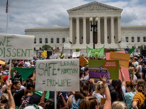 People protest in response to the Dobbs v Jackson Women's Health Organization ruling in front of the U.S. Supreme Court on June 24, 2022 in Washington, DC. The Court's decision in Dobbs v Jackson Women's Health overturns the landmark 50-year-old Roe v Wade case and erases a federal right to an abortion.