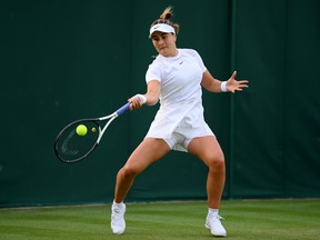 Bianca Andreescu of Canada plays a forehand against Emina Bektas of the United States during their women's singles first round match on day two of the 2022 Wimbledon Championships at The All England Lawn Tennis and Croquet Club on June 28, 2022 in London, England.