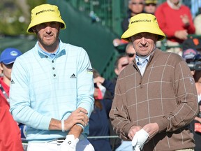 Dustin Johnson (L) and Wayne Gretzky wait on the 17th tee during the third round of the AT&T Pebble Beach National Pro-Am at Pebble Beach Golf Links on February 9, 2013 in Pebble Beach, California.