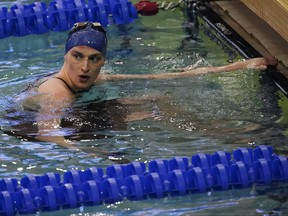 Lia Thomas of Pennsylvania waits for results after swimming the women's 200m freestyle final at the NCAA Swimming and Diving Championships, March 18, 2022, at Georgia Tech in Atlanta. Canada has voted in favor of a controversial gender policy announced this week by swimming's world governing body. In a gender inclusion policy that took effect on Monday, FINA only allows transgender swimmers who transition from male to female before the age of 12 to compete in women's events.