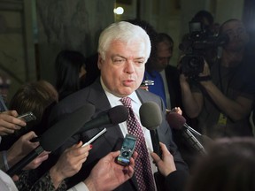New Democratic Party MPP Peter Tabuns answers questions from the media in Toronto on Thursday, February 21, 2013. THE CANADIAN PRESS/Michelle Siu