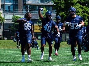 Argos defensive linemen (from left) Fabion Foote, Robbie Smith and Benoit Marion head off the field following a recent practice. The Boatmen’s defence did not record a two-and-out after the first series of the game in their 20-19 win over Montreal last week.