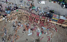 Aerial view of the collapsed grandstand in a bullring in the Colombian municipality of El Espinal, southwest of Bogotá, on June 26, 2022. (Photo by SAMUEL ANTONIO GALINDO CAMPOS/AFP via Getty Images)