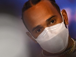Mercedes' British driver Lewis Hamilton attends a press conference ahead of the Formula One British Grand Prix at the Silverstone motor racing circuit in Silverstone, central England on June 30, 2022.