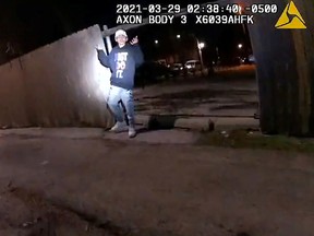 Adam Toledo, 13, holds up his hands a split second before he was shot by police in Little Village, a neighborhood on the West Side of Chicago, March 29, 2021 in a still image from police body camera video.