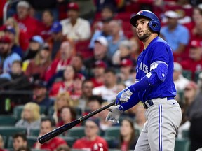 Blue Jays' George Springer hits a solo home run against the St. Louis Cardinals during the sixth inning at Busch Stadium.