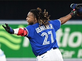 Blue Jays first baseman Vladimir Guerrero Jr. (27) celebrates after hitting a walkoff RBI single against the Boston Red Sox in the ninth inning at Rogers Centre.