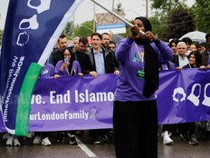 Prime Minister Justin Trudeau marches holding a banner with other attendees at an event marking first anniversary of the killing of the Muslim family Afzaal, in what police describe as a hate-motivated attack, at Oakridge Secondary school in London, Ontario, June 5, 2022.