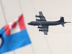 In this Sept. 8, 2019 file photo, a CP-140 Aurora airplane doing a flyby over Stanley Park in Vancouver to participate in a Battle of Britain commemoration.