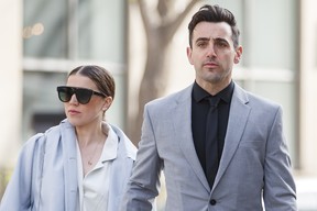 Canadian musician Jacob Hogard arrives with his wife Rebeka Asselstein on Tuesday, May 10, 2022, for a sexual assault trial at the Toronto County Courthouse in Toronto.