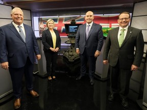 Ontario Progressive Conservative Party Leader Doug Ford, left to right, Ontario New Democratic Party Leader Andrea Horwath, Ontario Liberal Party Leader Steven Del Duca and Green Party of Ontario Leader Mike Schreiner pose for a photo ahead of the Ontario party leaders' debate, in Toronto, Monday, May 16, 2022.