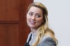 Amber Heard leaves during a break in the courtroom at the Fairfax County Circuit Courthouse in Fairfax, Va., Friday, May 27, 2022. 