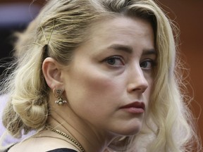Amber Heard waits before the verdict was read at the Fairfax County Circuit Courthouse in Fairfax, Va, Wednesday, June 1, 2022.