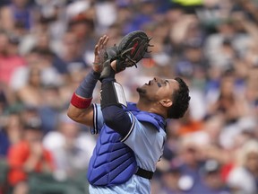 Blue Jays catcher Gabriel Moreno catches a popup hit by Tigers' Jonathan Schoop during the third inning of a baseball game, Saturday, June 11, 2022, in Detroit.