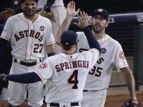 Astros’ Justin Verlander (right) and George Springer won a World Series together in 2017.