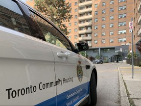 A cruiser with the Community Safety Unit of Toronto Community Housing was parked outside the 14-storey building on Shuter St. after a man was wounded in a shooting.
