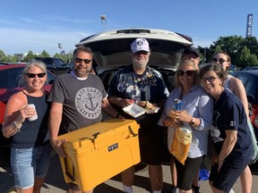 The Arnold family --Catherine, Bill, Carolyn and Logan -- enjoy a tailgate party prior to Toronto's season opener at BMO Field on Thursday, June 16, 2022.
