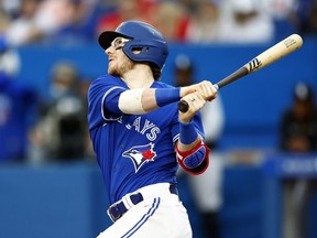 Blue Jays catcher Danny Jansen hits a three-run home run in the third inning against the White Sox at Rogers Centre in Toronto, Wednesday, June 1, 2022.
