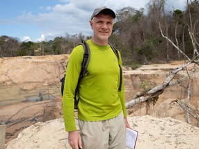 In this file photo taken on Nov. 14, 2019 veteran foreign correspondent Dom Phillips visits a mine in Roraima State, Brazil.