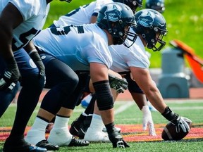 The Argonauts’ offensive line (left) should be improved this season with the addition of Justin Lawrence and the returns of Isiah Cage and, eventually, Peter Nicastro.