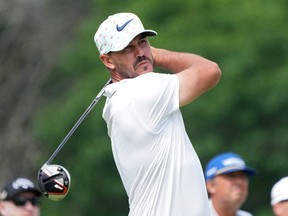 Brooks Koepka plays his shot from the eighth tee during the second round of the U.S. Open golf tournament June 17, 2022 in Brookline, Massachusetts.