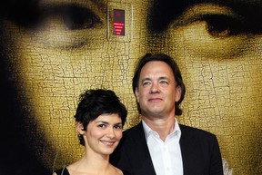 French actress Audrey Tautou (L) and US actor Tom Hanks pose upon arriving at the Cannes train station, southern France, 16 May 2006,  on the eve of the  start of the 59th edition of the Cannes Film Festival. (Photo credit should read VALERY HACHE/AFP via Getty Images)