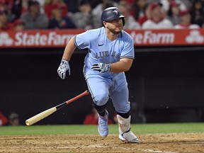 Pinch hitter Alejandro Kirk of the Toronto Blue Jays hits a one run base hit to score Cavan Biggio against relief pitcher Archie Bradley of the Los Angeles Angels of Anaheim during the seventh inning at Angel Stadium of Anaheim on May 28, 2022 in Anaheim, California.