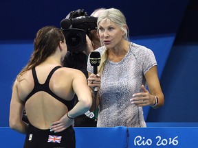 English former competitive swimmer Sharron Davies interviews Chloe Tutton of Great Britain following her Women's 100m Breaststroke heat on Day 2 of the Rio 2016 Olympic Games at the Olympic Aquatics Stadium on August 7, 2016 in Rio de Janeiro, Brazil.  (Photo by Julian Finney/Getty Images)