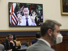 Rep. Greg Steube demonstrates assembling his handgun as he speaks remotely during a House Judiciary Committee mark up hearing in the Rayburn House Office Building on June 2, 2022 in Washington, DC.