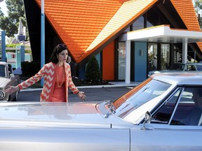 This undated publicity image released by AMC shows Jessica Pare as Megan Draper, left, and Jon Hamm as Don Draper in a scene outside of a Howard Johnson’s restaurant in an episode of “Mad Men.” AP Photo/AMC, Michael Yarish